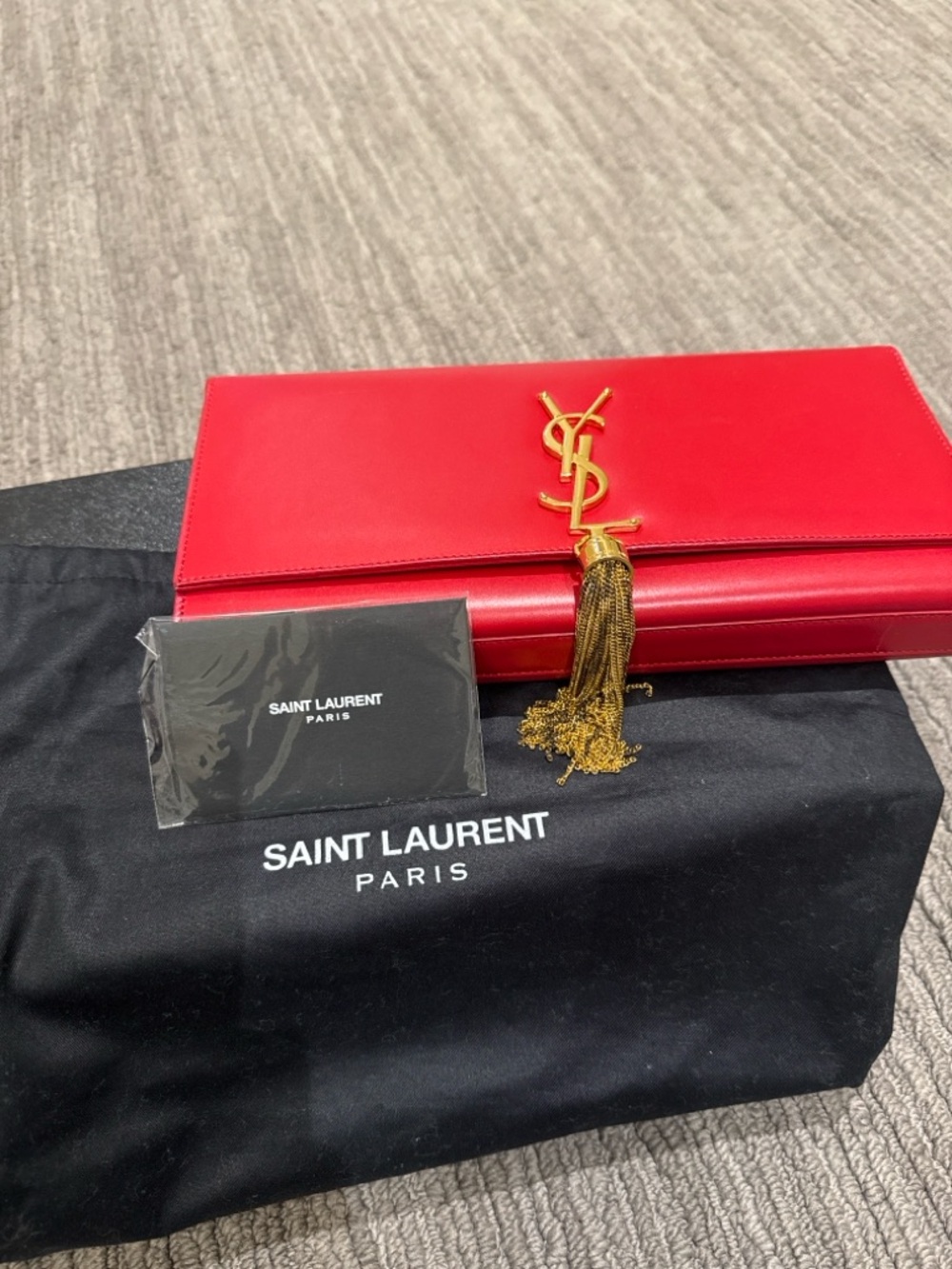Saint Laurent Red Leather Tassel Flap Clutch with Gold YSL Logo